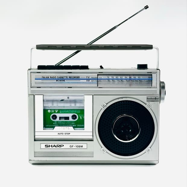 Silver radio cassette recorder framing the technology list